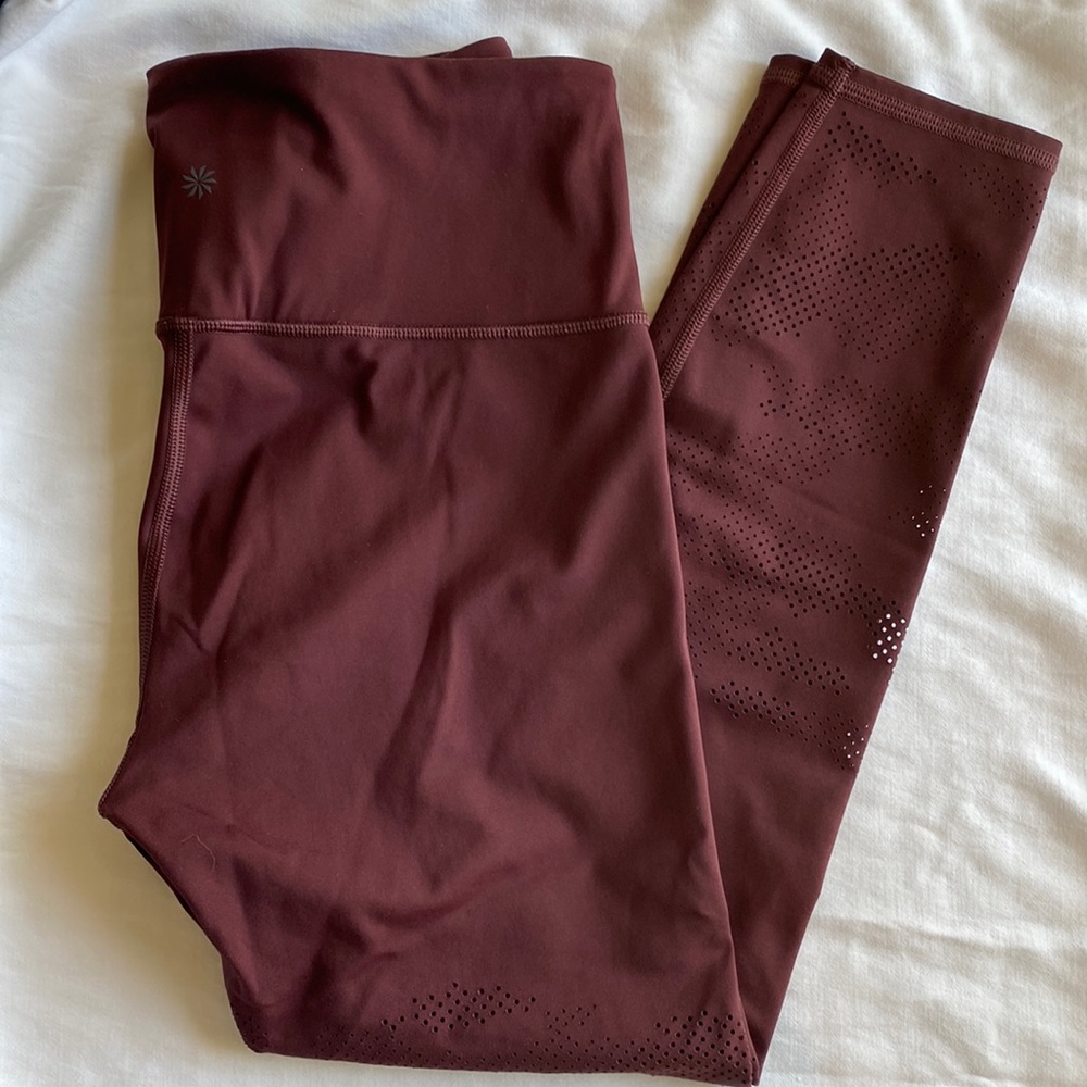 Athleta persistence laser cut 7/8 tight maroon workout leggings. Size M
